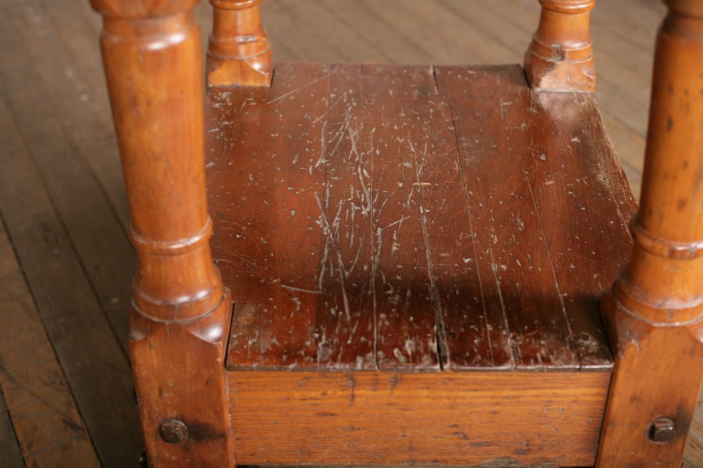 Vintage Industrial wooden framed turtle table with metal top and cast iron wheels. Similar available.