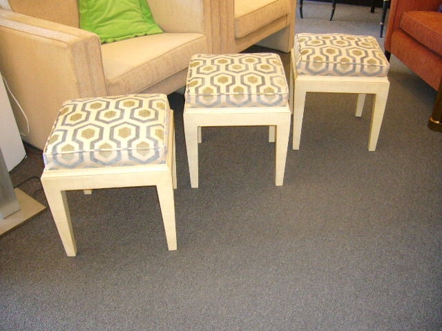 SOLD APRIL 2010 Very nice!!  Three modern stools with a faux parchment painted finish & cushions in a Hick's style cut velvet geometric pattern in blues and greens.  Simply yummy!  Removable cushions provide you with three ocassional tables if you