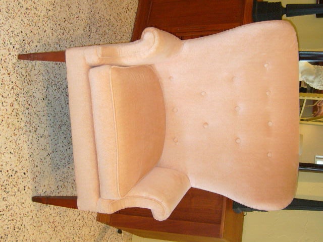 ...SOLD SEPTEMBER 2010... A wide, wonderful curving button tufted wingback highlights this classic modern Wingback chair.  In clean original pink velvet fabric, ready for your updating.  Handsome tapering front legs with a neoclassical molding touch