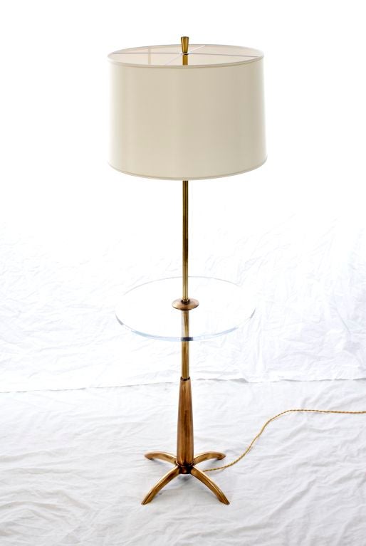 Wonderful brass floor lamp featuring a lucite table by Stiffel. Custom silk shade made in Paris.