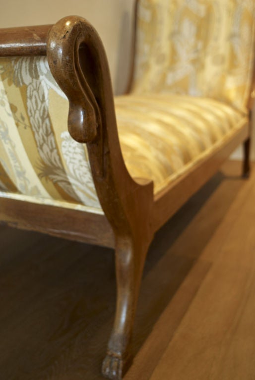 Gorgeous walnut chase with custom upholstery.