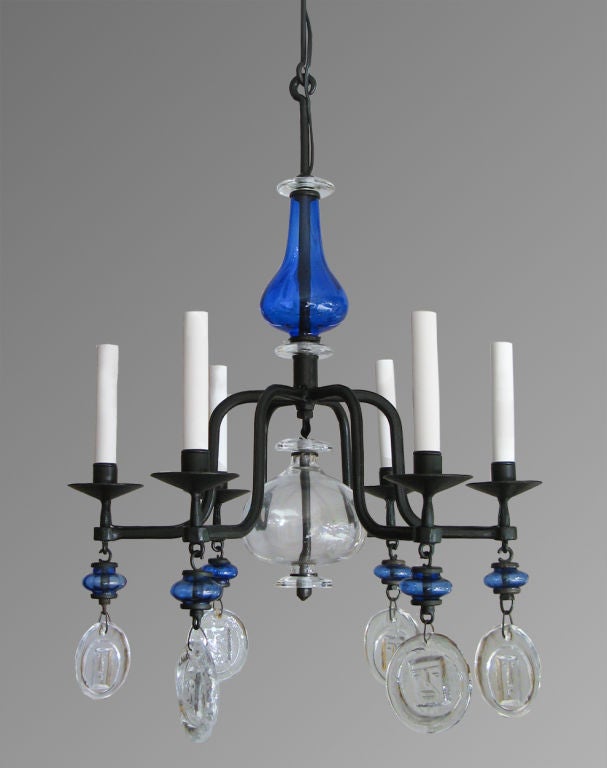 Swedish 6-arm chandelier with hand wrought iron frame with blue and clear glass. Designed by Erik Hoglund for Boda Nova Glassworks/Axel Stromberg Ironwork, Sweden circa 1960's. Newly electrified for candelabra base sockets. Height 27
