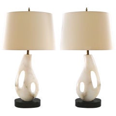 Pair Italian free-form carved alabaster lamps with marble bases.