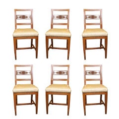 Six French carved back dining chairs