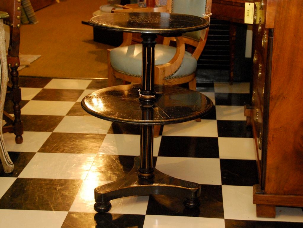 19th c. ebonized dumb waiter with two graduated round tiers