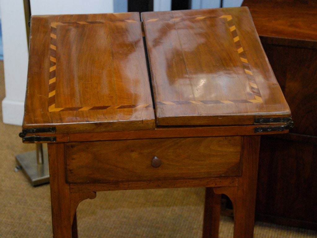 Game table having inlaid folding top