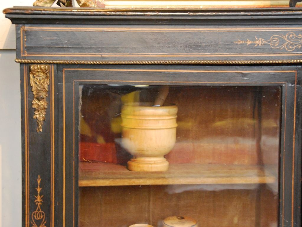 French ebonized glass front cabinet