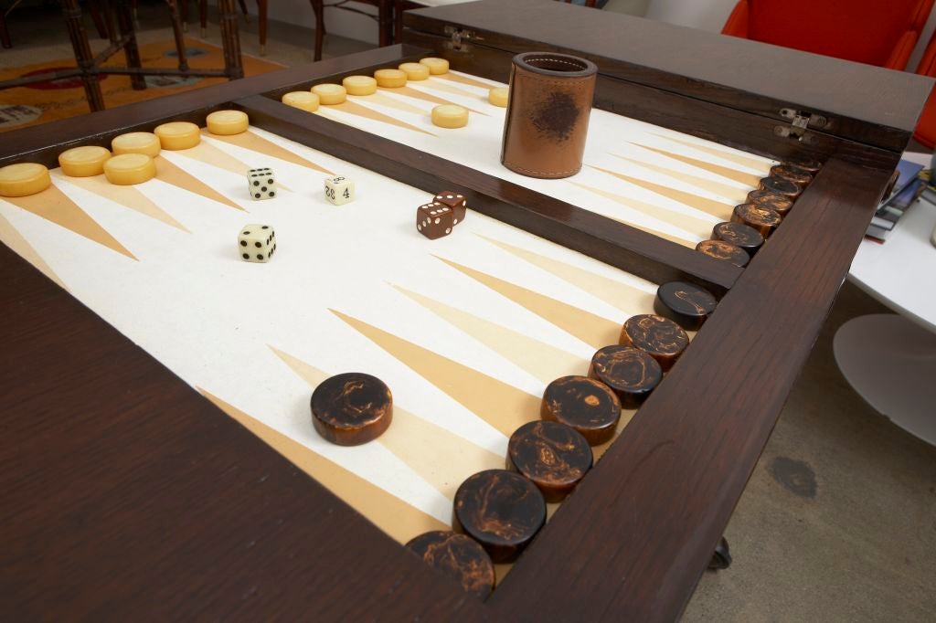 Designed by McGuire; a vintage Backgammon table made of the McGuire signatory bamboo with wood top. The table has two slats on hinges that close on the game board, so it can also be a great writing table. It is on wheels so easy to move from room to