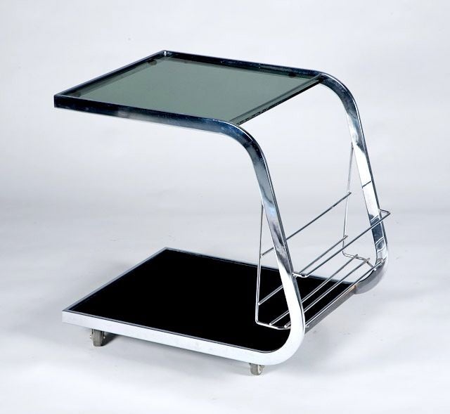 Very chic chrome bar cart with smoked glass insets by Jacques Dumond. Visit Quotientnyc.com to view our complete collection.