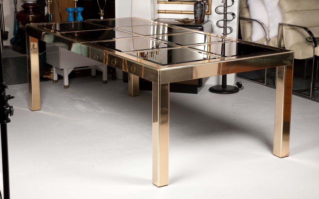 Mastercraft Brass framed dining table with an 8 panel bronze beveled mirrored top. Table comes with 2 extensions which measure 19.5