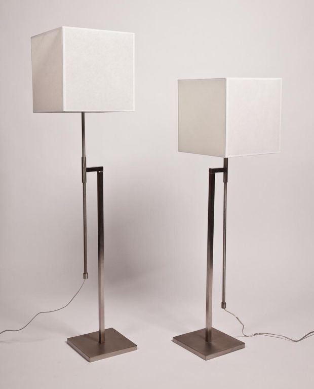 Exceptional pair of polished nickel adjustable floor lamps. Visit Quotientnyc.com to view our complete collection. Shades not included, but available upon request.