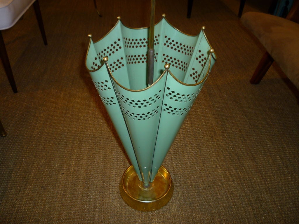 Umbrella stand with perforated metal and scalloped rim. Original paint. Color is a deep shade of aqua.