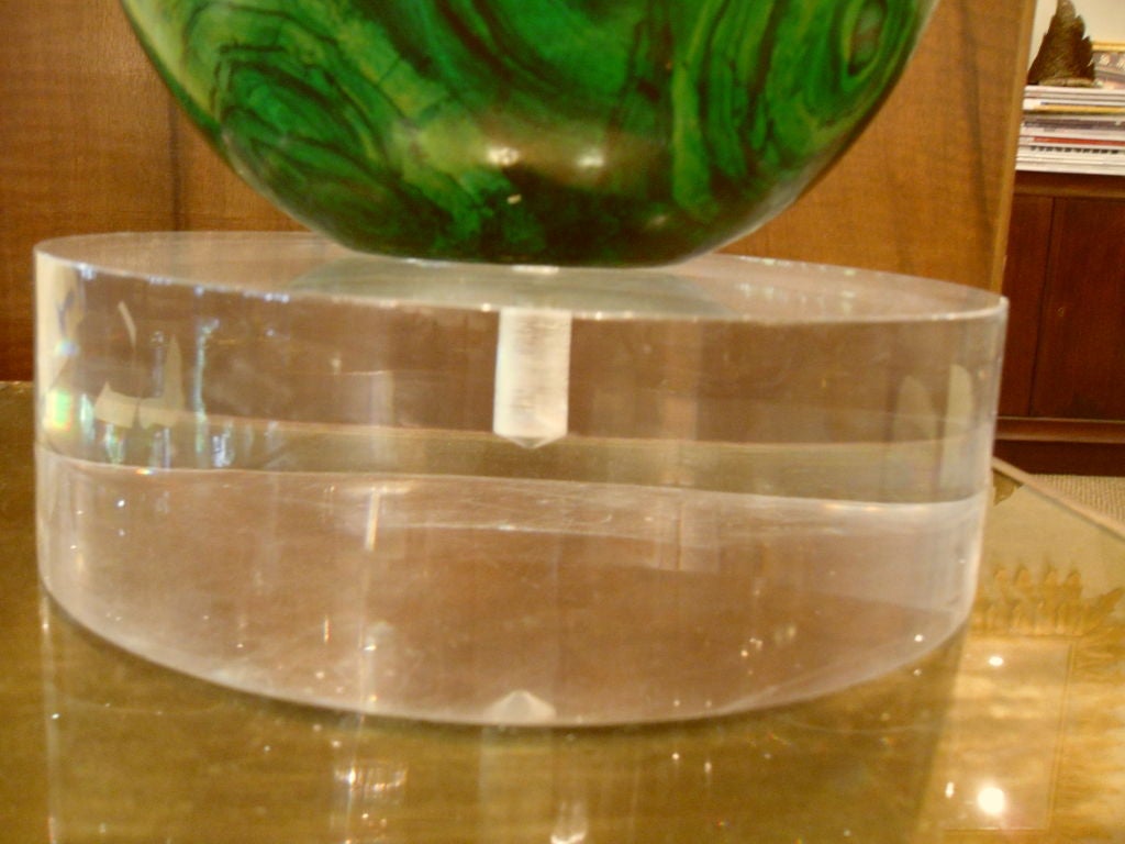 Unique decorative accent for any space, dramatic colorful malachite egg on a large lucite base.