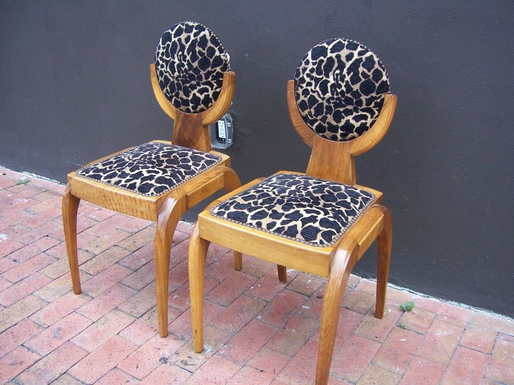 Extraordinary shape in fruitwood make these truly luxurious Austrian deco side chairs.  Vintage animal print upholstery is in very nice condition. TWO pairs available.