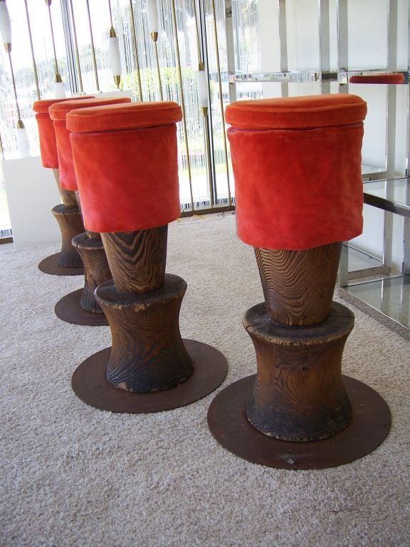 Original creation for the Morgans Hotel in New York, designed by Andrée Putman. These beautiful totem stools in rustic finish wood showing natural cracking and distress from age and use, have iron platforms for better stability. Upholstery in