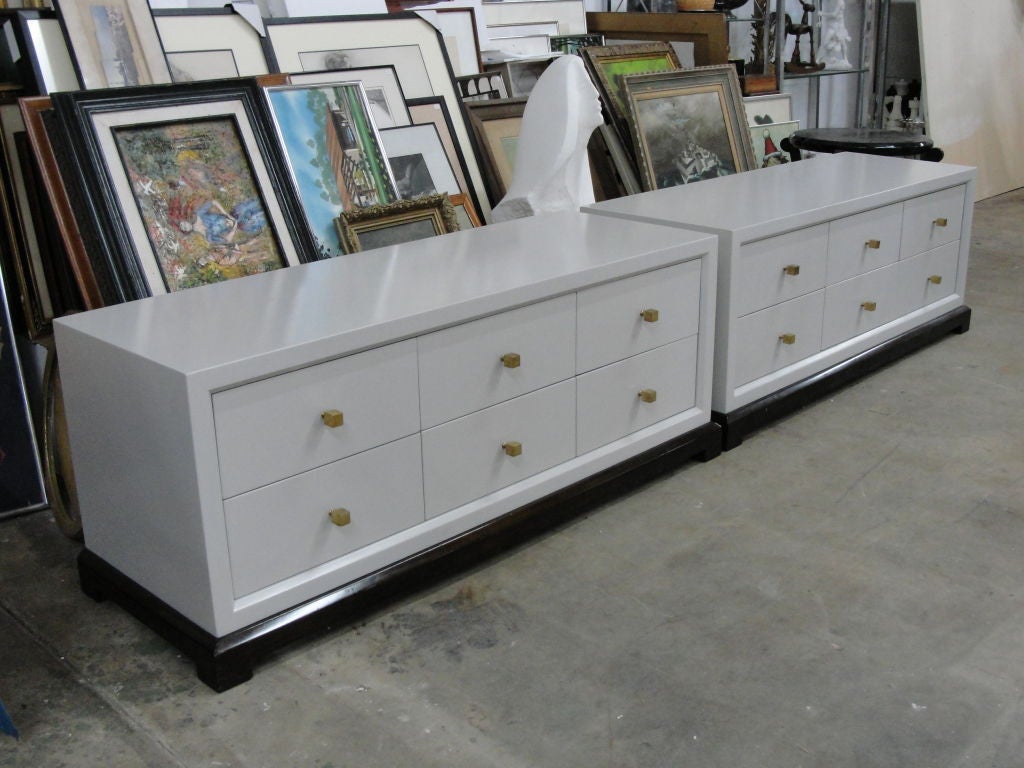 PRICE DISCOUNTED FOR 1STDIBS SATURDAY SALE – ONE WEEK ONLY.  NO ADDITIONAL DISCOUNTS, NO HOLDS.  ITEM WILL BE RETURNED TO REGULAR PRICING AFTER 7 DAYS.<br />
<br />
Light grey lacquered cabinets on ebonized wood bases, six drawers with stunning