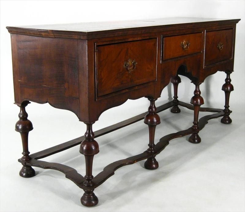 William & Mary Style Walnut and Burl Walnut Sideboard with 3 drawers on turned legs with shaped stretcher support.

Keywords:  buffet, sideboard, server, entry hallway pieces, sofa table, hutch.