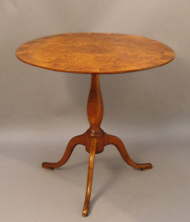 Round tilt-top table, Sweden circa 1800, in original condition. The pieced alder root top has a border of contrasting straight-grained alder. The three cabriole legs terminate in nicely carved pad feet.