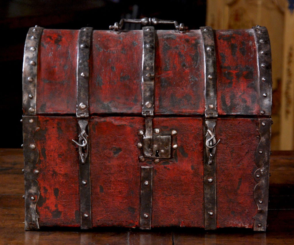 An Early & Rare French Red Lacquered  <br />
Leather Bound Wood & Iron Small Chest <br />
 <br />
Height 15 in. Depth 9 in. Width 13 in. <br />
  <br />
      Provenance: Chateau de la Grange Yerres (Essonne)Propriete du Marechal de Saxe