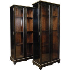 A Pair of Ebonized 
String Brass Inlaid Neoclassic Cabinets
