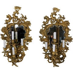A Pair of Mirrored Four Arm Bronze Girandoles
