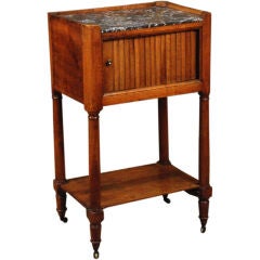 A Louis XVI Fruitwood Marble Top Stand with Tambour Door