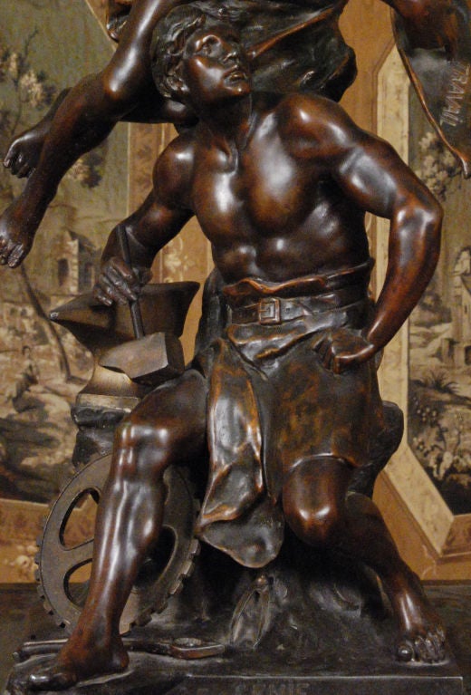 A Bronze Patinated Metal Statue <br />
Signed E.Picault<br />
<br />
“Le Genie du Travail”<br />
<br />
Emile Louis Picault was born in Paris in 1833 and died in 1915.  In 1863 he began to exhibit at the Salon in Paris until 1906.  He