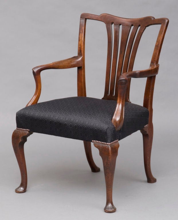 George II period Chippendale mahogany armchair with shaped top rail above five vertical pierced splats, molded arm supports, very generous seat in width and depth, raised on cabriole legs ending in pad feet. Upholstered in patterned black horsehair