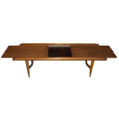 Unusual walnut coffee table w/  slide our tops & melamine insert