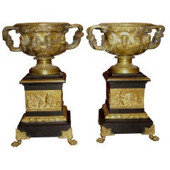19th/20th century pr of gilt bronze Warwick urns on slate bases