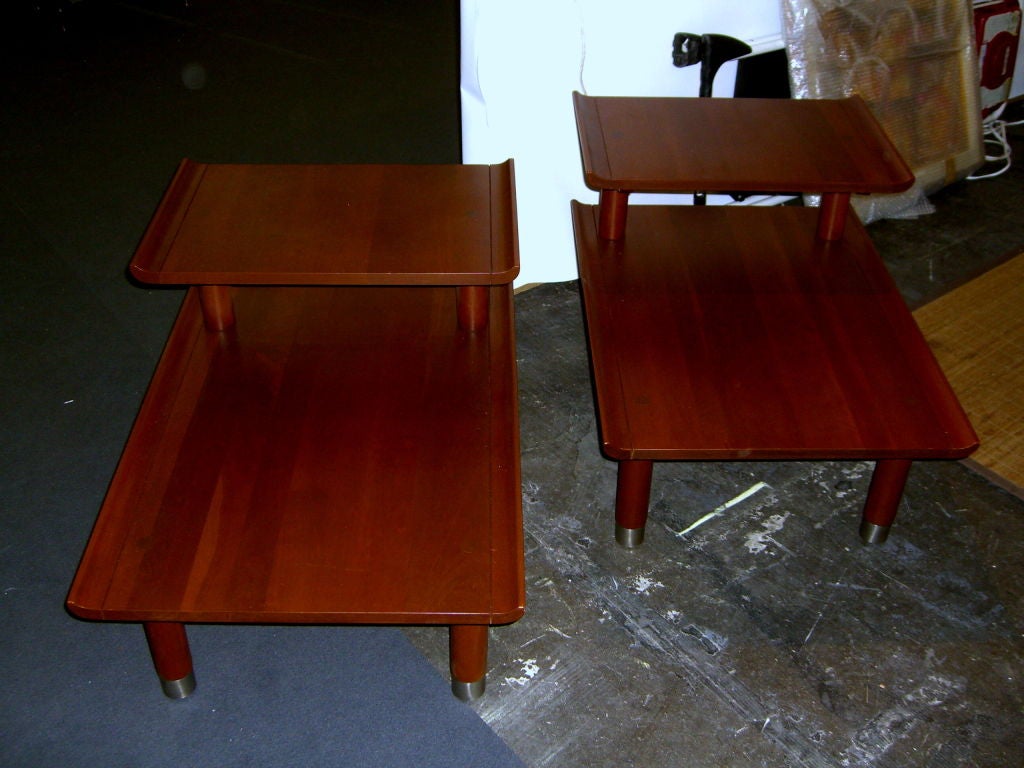 A nicely designed pair of Willett Furniture solid Cherry side or end tables from their Trans-East collection. They probably designed this line after Baker furniture came out with it's Asian lines in the late 1950's. These tables have nice design