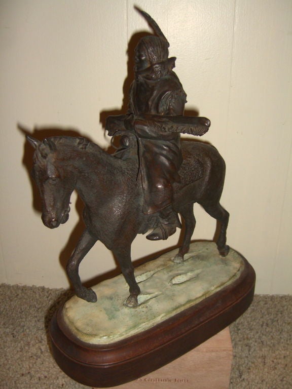 A wonderful bronze by the noted American artist and historian Carl J. Pugliese (1918-1982). This bronze is mounted on a wood base and titled 