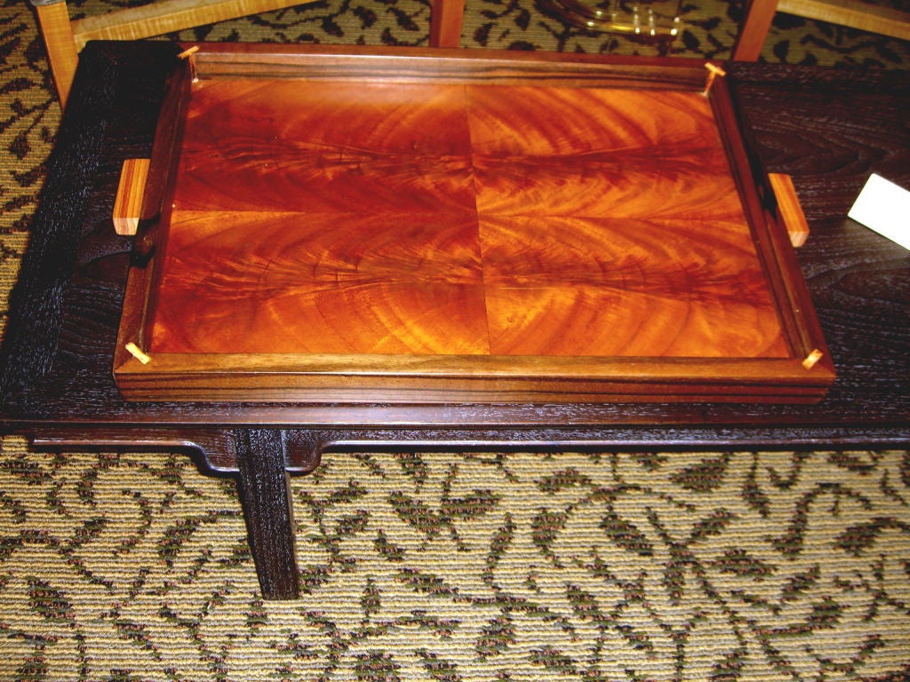 A great craftman's tray made of Macassar Ebony and crotch mahogany book matched veneered interior. The frame is solid Ebony and the quality is superb. It came from the same estate as the Tulipwood tray we have listed. e have had the based re-lined