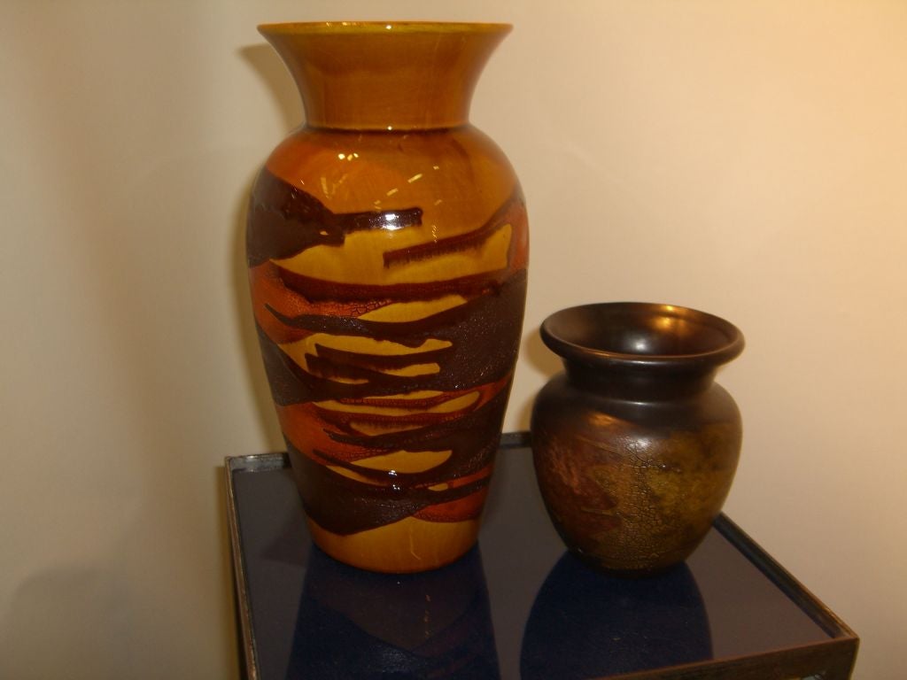 A nice pair of Haeger Earth wrapped vases. One is large and has a glossier finish the other is smaller with a matte finish. The larger one is 12 inches tall and 6 inches in diameter, the smaller is 5.5 inches tall and 4.5 inches in diameter.