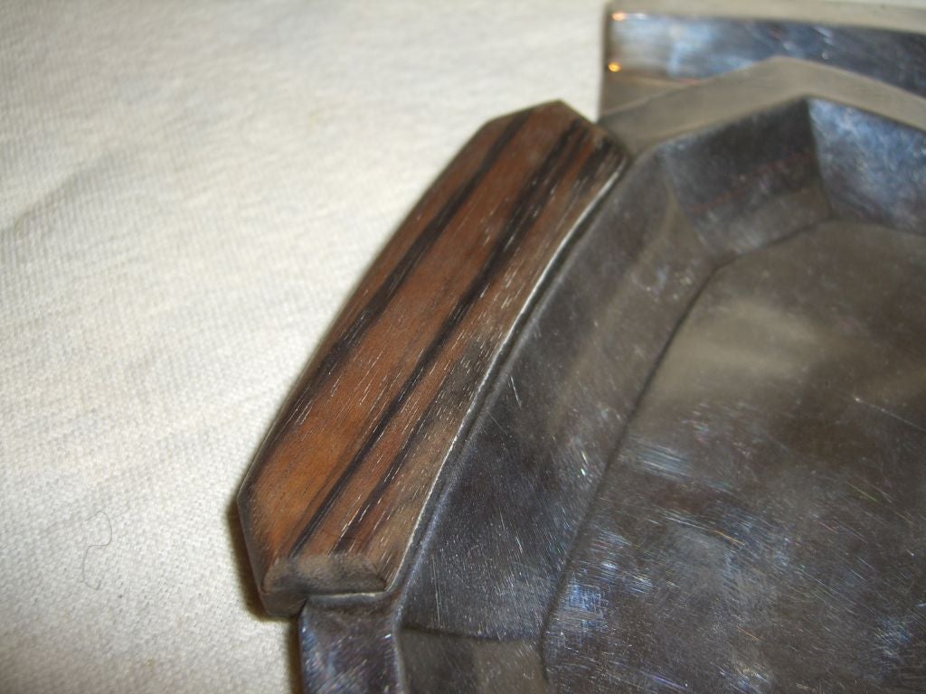 A nice crumber or crumb set of utensils, made of silver plated bodies and ebony handles. They are both marked with the maker's logo and the smaller piece has a 3 and the larger a 5. Larger piece is approx 8x7 inches and the smaller approx 3.5x5.5