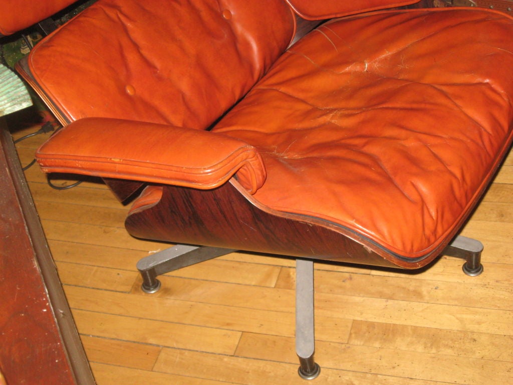 Down 1950s Rosewood Lounge Chair 670 by Charles and Ray Eames