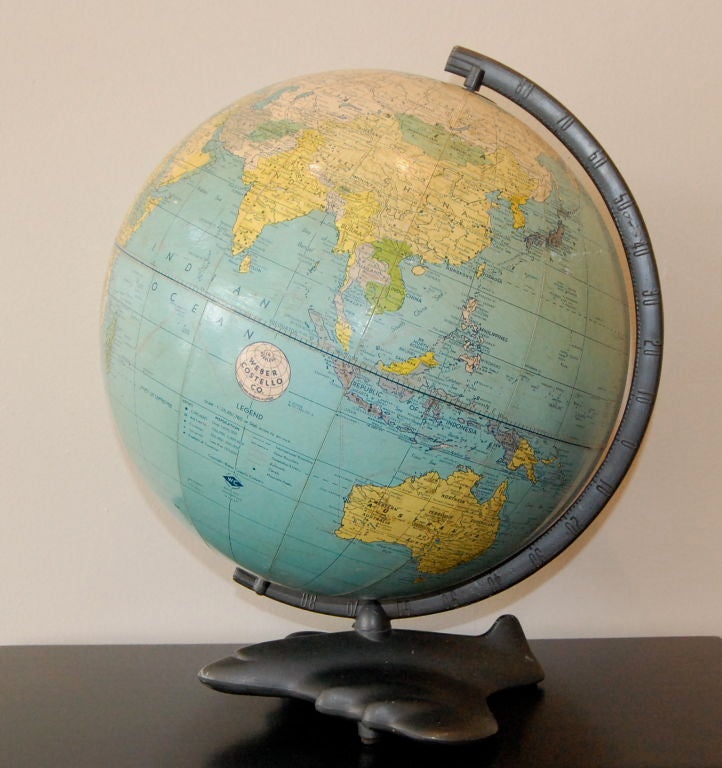 Art Deco globe by Weber Costello, the world of the late 1930's to 1940's French West Africa, Anglo-Egyptian Sudan, Belgian Congo Angola, Indo-China, resting on a stylized airplane base.