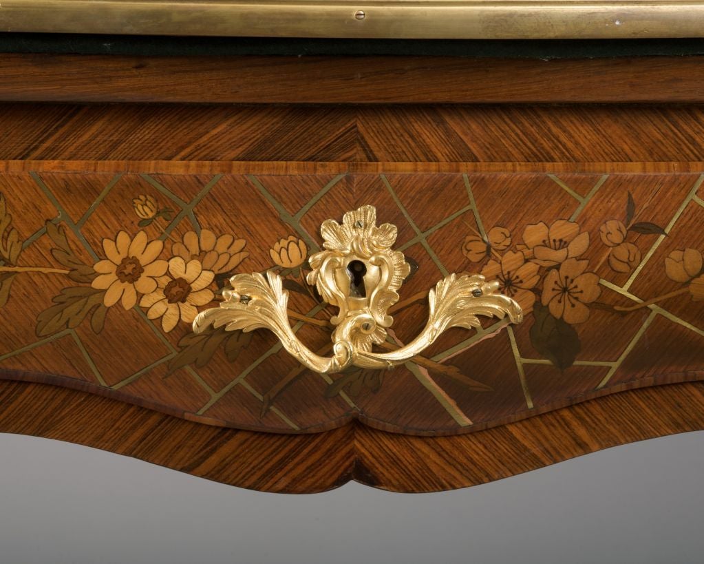 Attributed to Ferdinand Duvinage, the shaped square hinged handkerchief top rotating open to reveal a felt top, the frieze with two drawers, the whole inlaid with brass 
