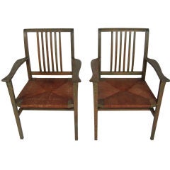 PAIR OF ARTS AND CRAFTS GREEN STAINED ARMCHAIRS
