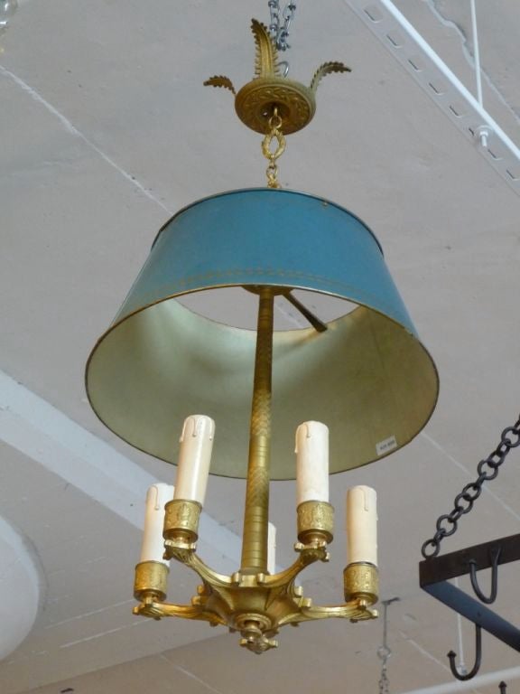 A wonderful gilt bronze 5 light chandelier with a blue tole shade. Needs electrification.
