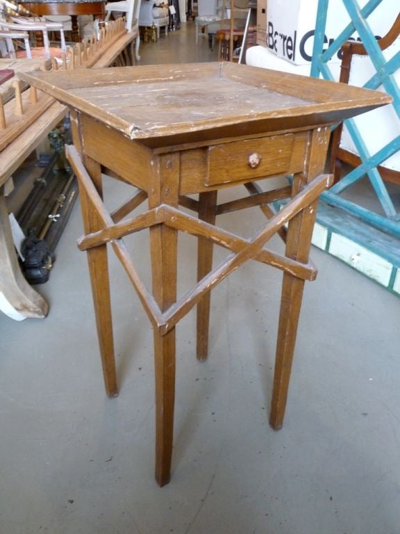 A 19th century faux grain Primitive work table with X-sides.