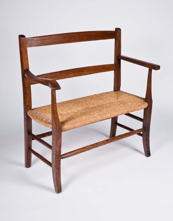 A charming French small oak bench with ladder back and rush seat, from Avignon in the south of France
