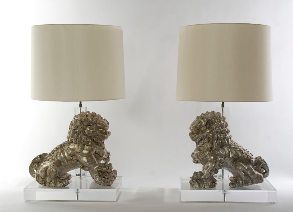 SOLD AS A PAIR / $4,000 FOR THE PAIR<br />
+ This pair of temple dogs will protect your home in the most glamourous way<br />
+ Sculptural quality and high visual impact<br />
+ Massive iron 