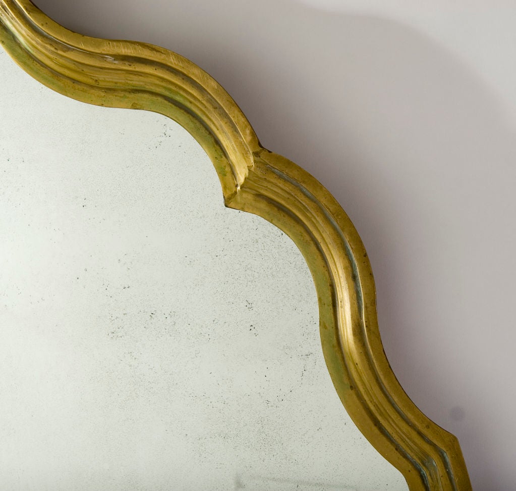+ A gorgeous serpentine style circular mirror that will be the focal point of any room<br />
+ Great scale for placing over a fireplace or a large case piece<br />
+ Originally a table top, we have transformed this stunning object into a wall