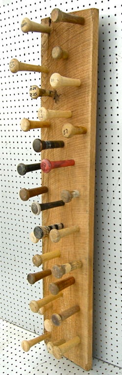 A whimsically amusing sculpture composed from a collection of vintage baseball bat handles. Having interesting original graphics and wrappings on the tops with time worn and weathered patinas to the bases. An original and artistic take on the great