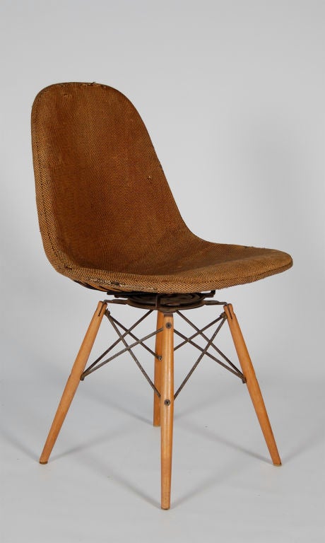 Charles Eames rare swivel dowel leg chair with birch legs, swivel mechanism from Seng of Chicago, wire top with hopsack pad, original label to underside of cover. <br />
All 4 foot glides in place. <br />
Bikini pad available in the same fabric if