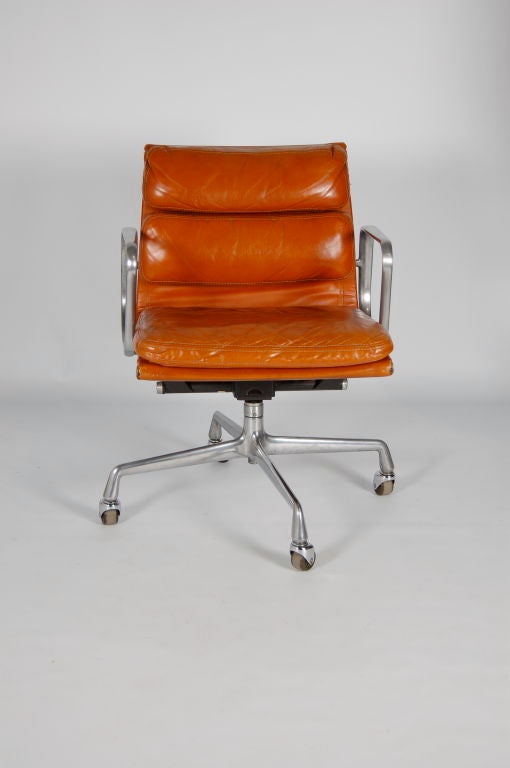 Charles Eames for Herman Miller Soft Pad desk chair with tan leather , height adjustable , swivel , tilt and tilt limiter . Earlier 4 star base on castors