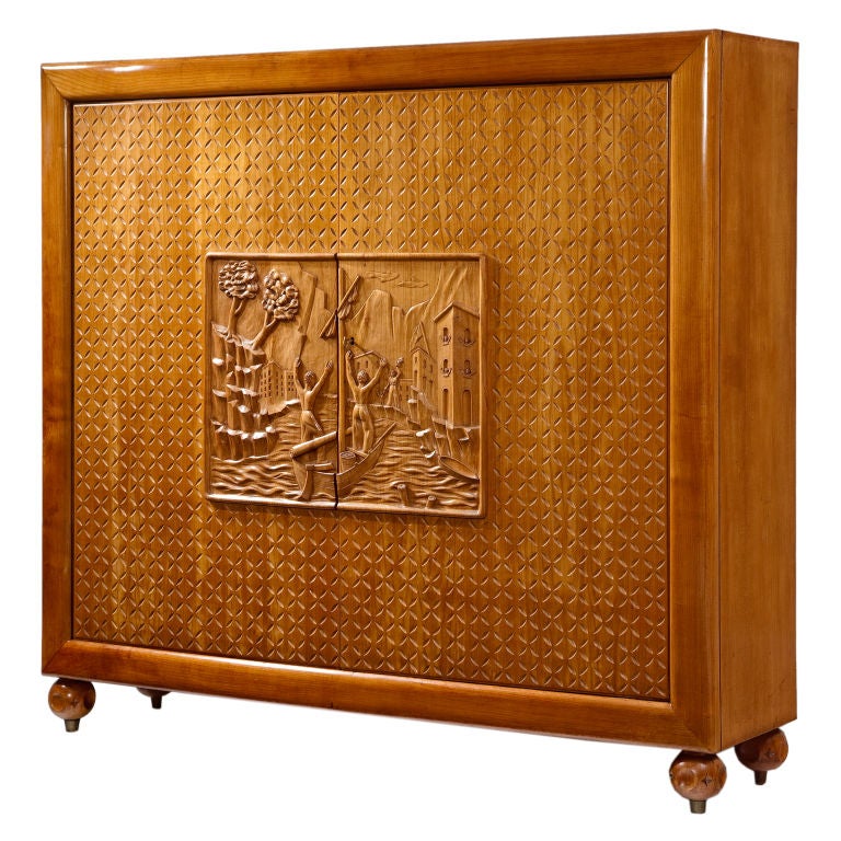 Cabinet by Osvaldo Borsani with carving by Voltan For Sale