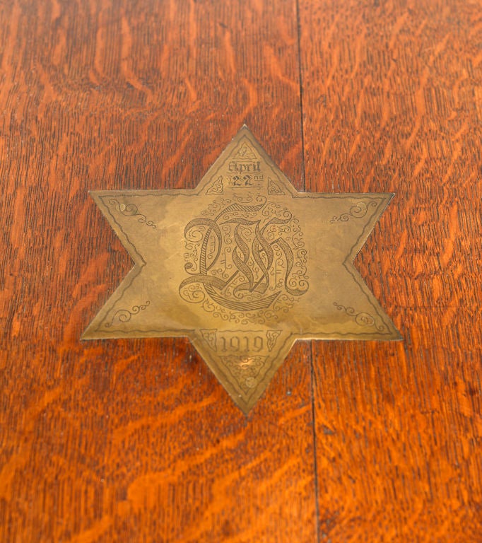Unusual oak side table bearing monogram and date.