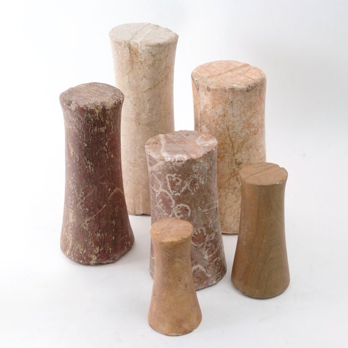 Collection of  six ancient Bactrian 'column idols'. <br />
Tapering cylindrical forms of varying sizes and marbles, with shallow grooves at top and bottom, in some cases extending round columns completely.<br />
Standing from 7 inches high to 14